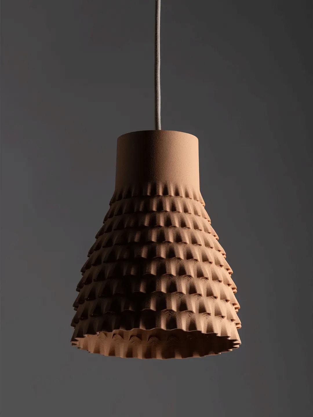 The Orion pendant lampshade in terracotta red