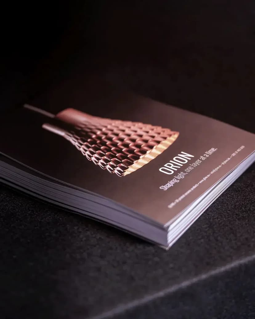 Glino brochure at BigSEE design exhibition showcasing ceramic lighting products